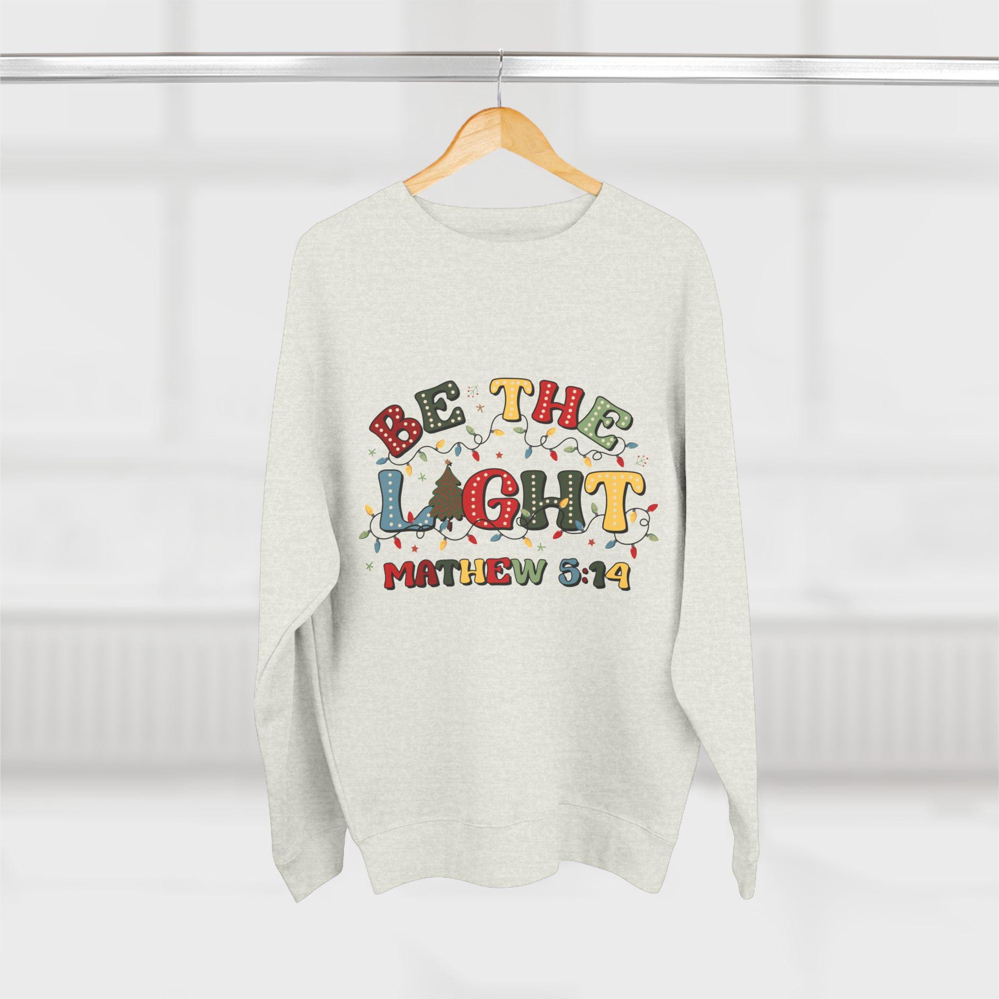 Be The Light Christmas Crewneck Sweatshirt: Festive Holiday Jumper